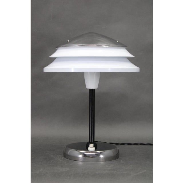 Mid-century table lamp designed and produced by zukov in czechoslovakia during the 1970s. The lamp features a chrome...