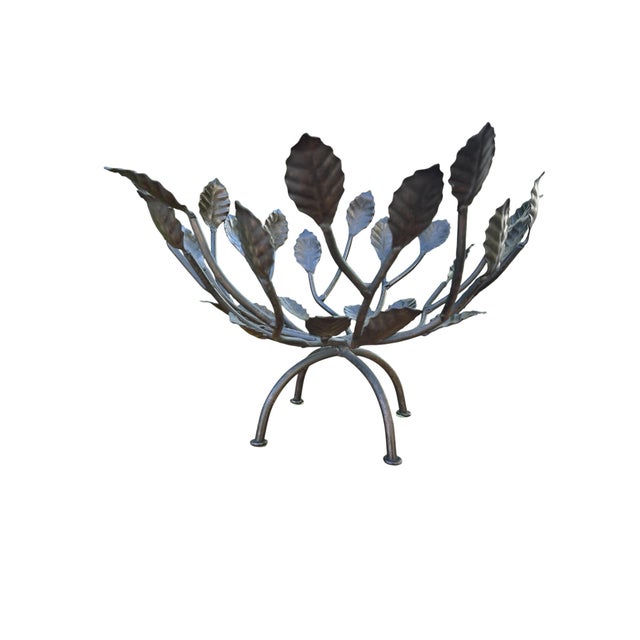Vintage hand-forged metal centerpiece bowl featuring an organic branching leaf form design with a dark patinated finish....