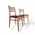 A stylish pair of mid-century dining chairs originating from Czechoslovakia, showcasing clean lines and beautifully curved...