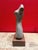 Beautiful stone feminine scupture. Color and artistry ver fine.Color of stone unusual. Lovely decor piece. Piece is about...