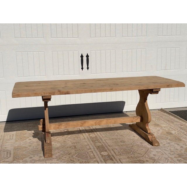 Early 20th-Century French Oak Monastery Dining Table A striking early 20th-century French oak trestle table with warm...