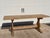Early 20th-Century French Oak Monastery Dining Table A striking early 20th-century French oak trestle table with warm...