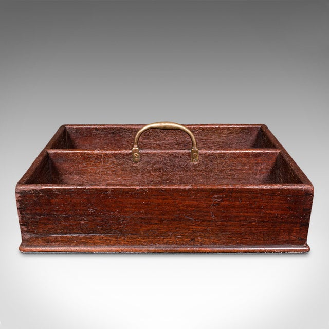 This is an antique housemaid's carry. An English, estate made mahogany and brass butler's work box or country house...