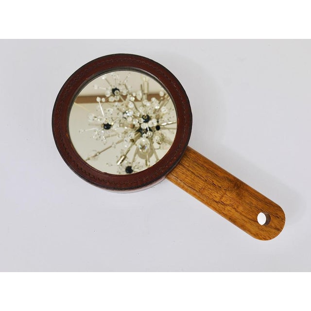 A beautiful Mid-Century hand mirror and clothes brush combination from the 1950s. Designed and executed in the 1950s by...