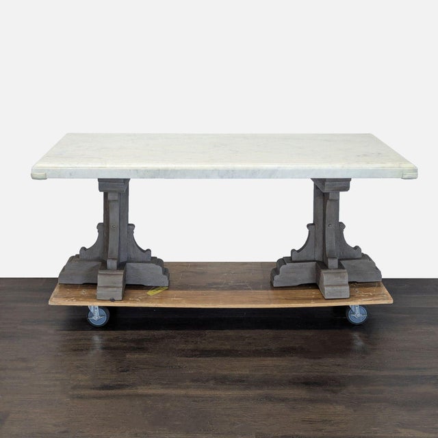 This elegant Restoration Hardware dining set includes a sturdy marble-top table and six comfortable upholstered chairs....