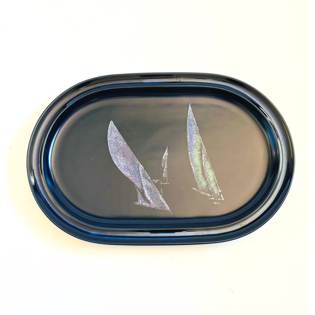 A large vintage stoneware serving platter. Made in the "Spinnaker" pattern by Noritake, Japan. Dark blue glaze featuring a...