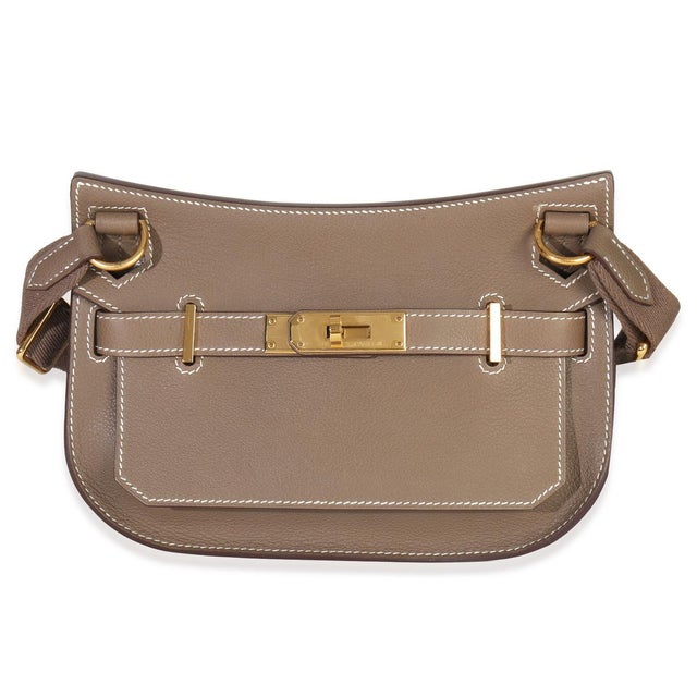 Item #: Z151614 Interior Material: Leather Size: Mini Features Interior: One slip pocket Dimensions: 8.25 x 6 x 1.75 in...