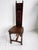 A late Victorian Gothic Revival hall chair crafted in solid oak, featuring a tall architectural back with carved tracery,...