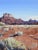Moab Plateaus by David Shingler | Oil on board Landscape of rocky plateaus under a blue sky. For Sale