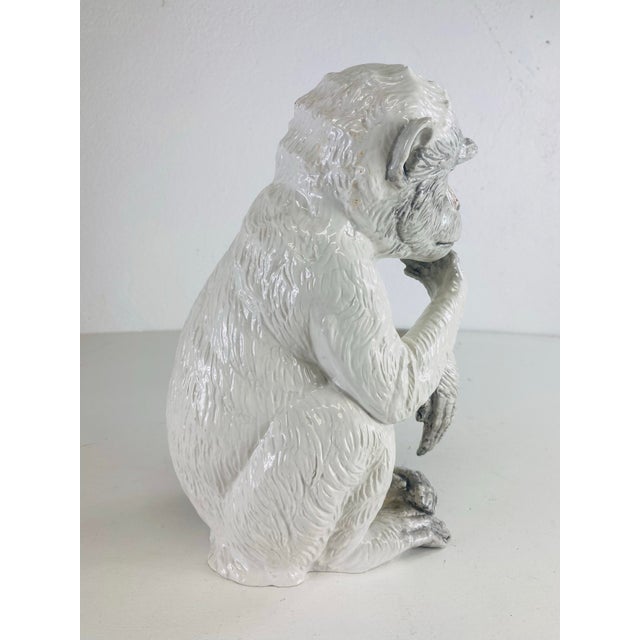 This is a mid-century vintage hand painted Italian pottery monkey sculpture. This pottery sculpture has a cream colored...