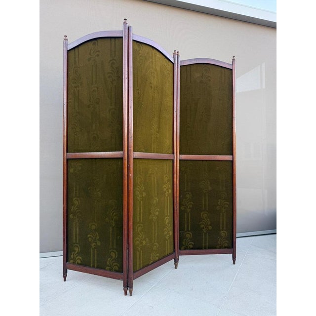 Elegant early 20th-century Austrian Secession folding screen or paravent with original olive-green patterned textile...