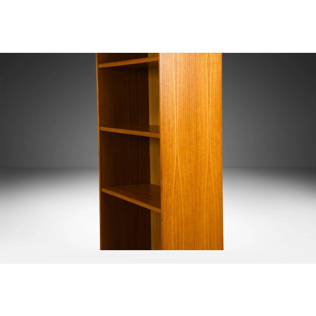 An exceptional teak tall bookcase. Gorgeous Mid-Century Modern Teak bookcase / tall bookshelf unit. Beautiful, minimalist,...