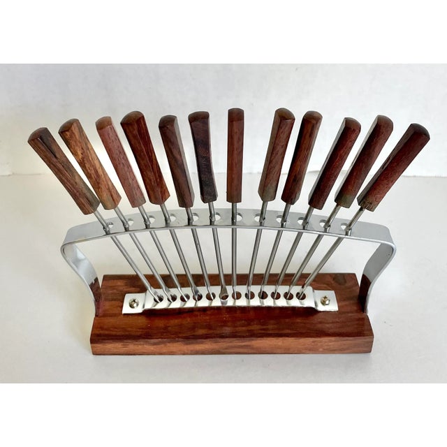 Here is a beautiful and modern set of 12 appetizer sticks with rosewood handles and stainless forks. The sticks are...