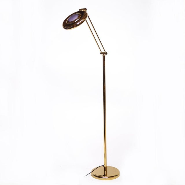 This vintage floor lamp features an adjustable neck and a purple circular decorative shade. This piece is attributed to...