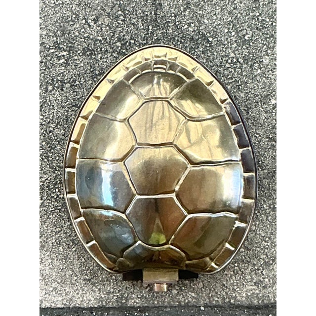 Illuminate your space with the captivating allure of this vintage brass tortoise shell sconce. Its unique, sculptural...