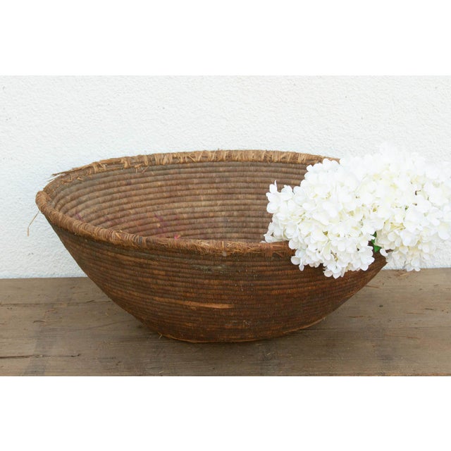 At a massive 28 inches wide, this oversized nomadic harvest bowl is a spectacular testament to tribal utility and...