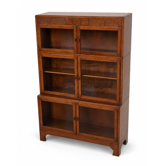 A characterful Minty Ltd Oxford glazed sectional library bookcase, made by Minty Limited – Library Specialists, Oxford....