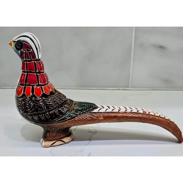Add a rare hit of color and character to your space with this vintage Artesania Rinconada ceramic pheasant from Uruguay....