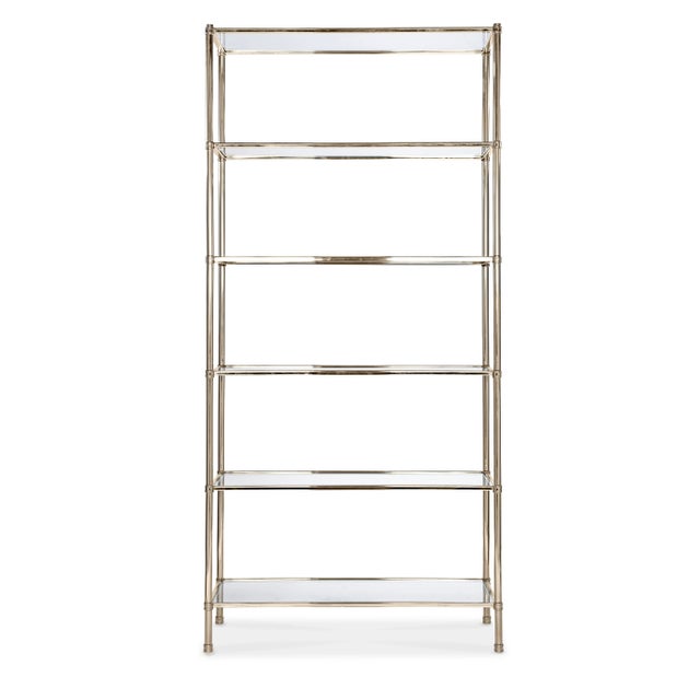 Refined nickel etagere with tempered glass shelves. Polished finish.