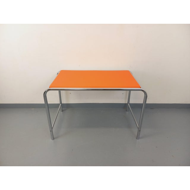 Vintage 1970s Space Age desk, fully refurbished orange vinyl top, tubular chrome legs in the style of Marcel Breuer, very...