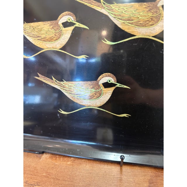 Vintage black lacquer serving tray featuring three stylized shorebirds in flight. Likely mid-century, with hand-painted...