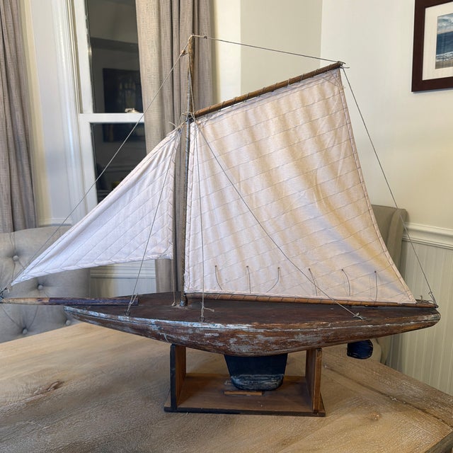am absolutely obsessed with the incredible, weathered soul of this antique pond yacht. It has that perfect, unaltered...