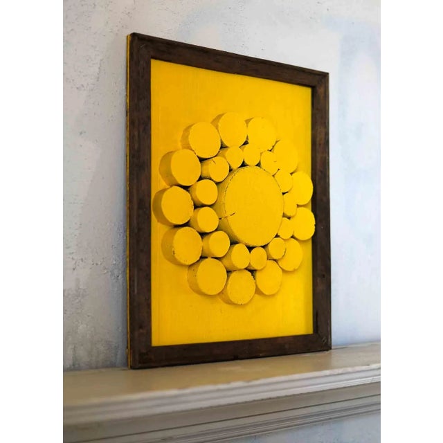 Vintage abstract geometric sculptural relief in frame. Yellow painted circular wooden elements make up this radiant piece.