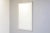 Beveled glass large French mirror wih decorative wood and plaster frame in white paint.