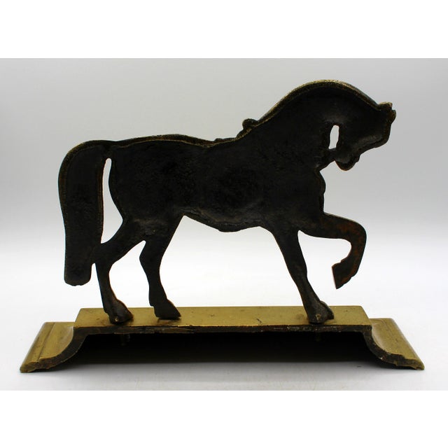 English heavy brass horse doorstop, circa 1870. Beautifully modeled in leg raised stance. Molded plinth base. A wonderful...