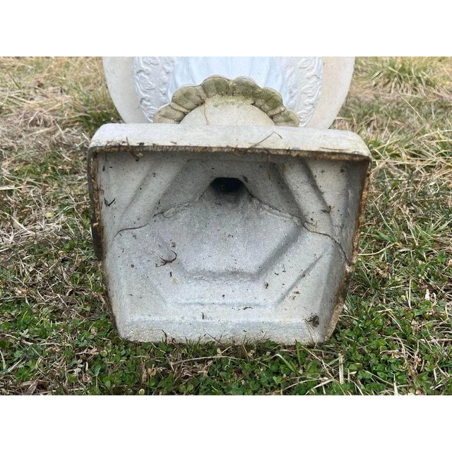 Pair Of Antique Cast Metal Urns. Height 24”. Semi-loped campana form with styled foliate rim above on square base Some...