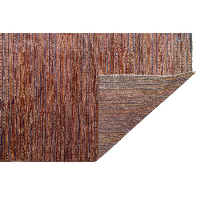 This striking modern Savannah rug features a sophisticated linear design, hand-knotted in India from premium wool. The...