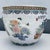 An elegant decorative statement inspired by traditional Chinese artistry, this vintage hand-painted porcelain fish bowl...
