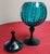 This stunning vintage apothecary jar is crafted from vibrant turquoise glass featuring a optic rib pattern, that creates a...