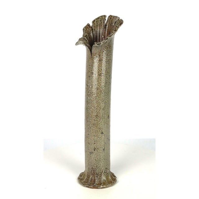 Tube vase with corolla neck by Gustave Tiffoche, 1960. Stoneware with mottled glaze ranging from beige to grey. Incised...