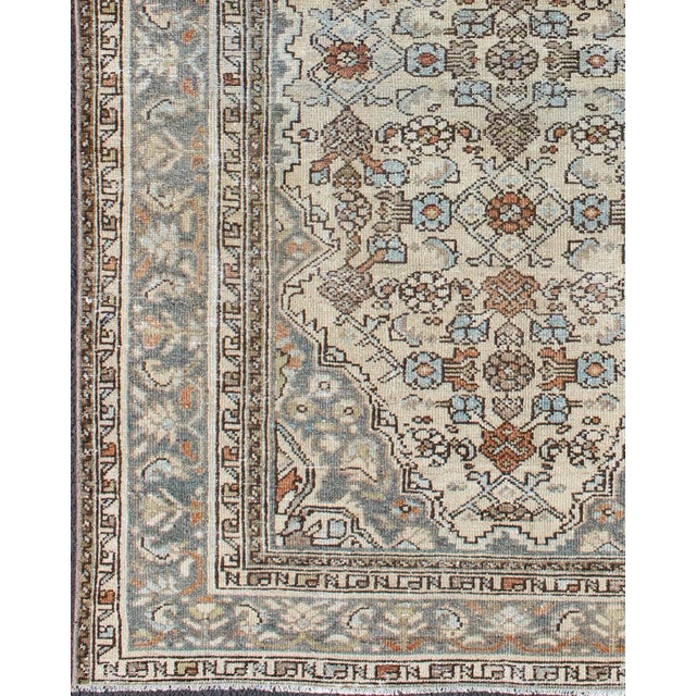 Measures: 4'4 x 6'4. Antique Persian Malayer Rug with Soft Blue, Ivory, and Brown Geometric Medallion Design. Keivan Woven...