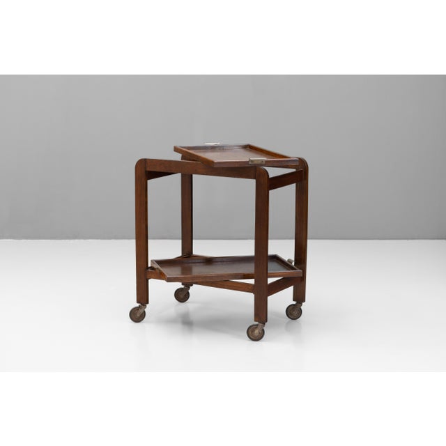 Solid oak drinks trolley in an Art Deco style. Removable serving trays. U.K circa 1950.