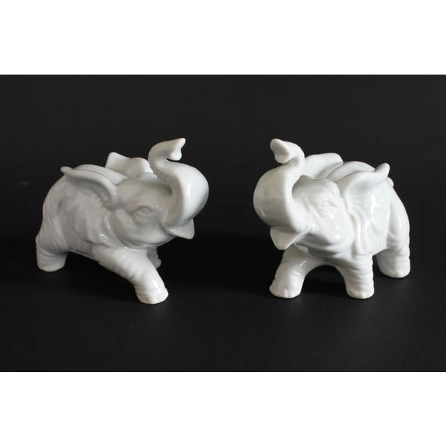 Pair of white ceramic decorative elephant figurines. No makers mark. No chips.