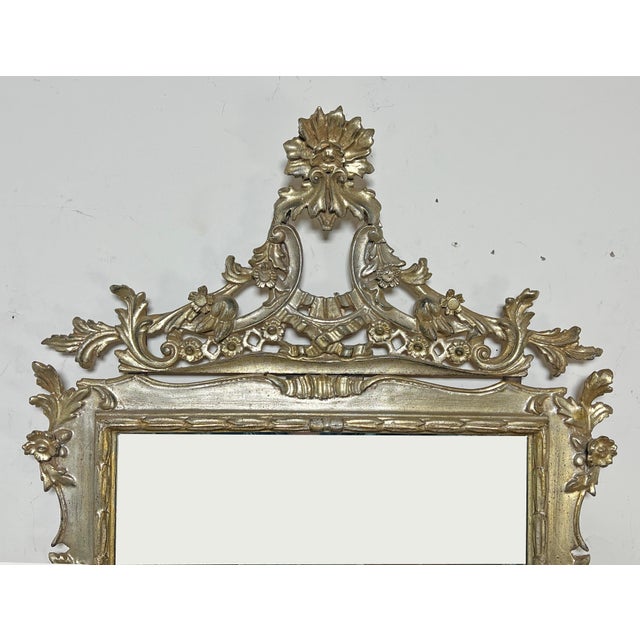 A hand carved Italian neoclassical mirror in silver leaf, ca. 1950s.