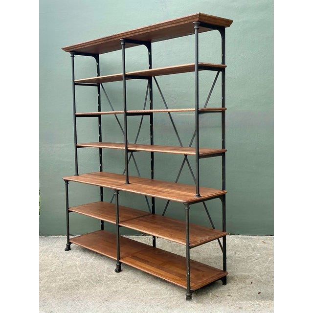 This monumental French-inspired etagere is a masterclass in industrial elegance, seamlessly blending robust metal...