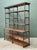 This monumental French-inspired etagere is a masterclass in industrial elegance, seamlessly blending robust metal...
