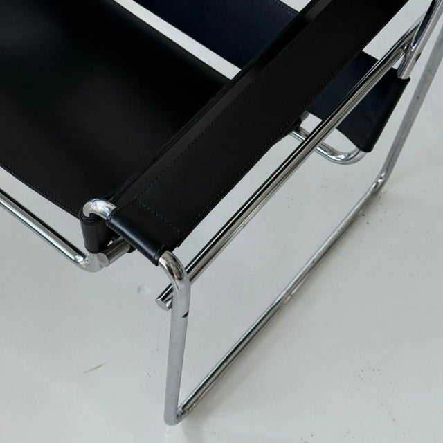 c. 1970s. Italy. Price is for the set. Contact us if you’d like to purchase a single item. Black leather slings with metal...