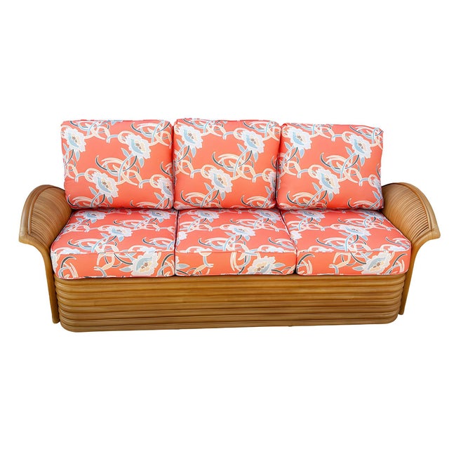 Experience timeless elegance with this beautifully restored rattan fan arm 3-seater sofa. This is a one-piece sofa design...