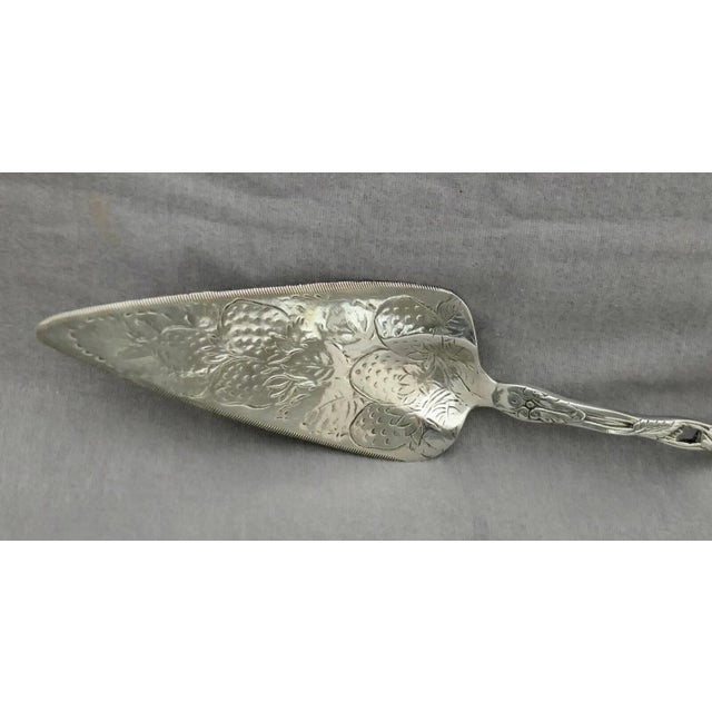 This vintage stylish solid sterling silver server dates from the mid century (1960’s) & showcases a strawberry design. The...