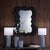 This bold black wall mirror is expertly designed and artisan-crafted from strong, lightweight resin. Its richly textured...
