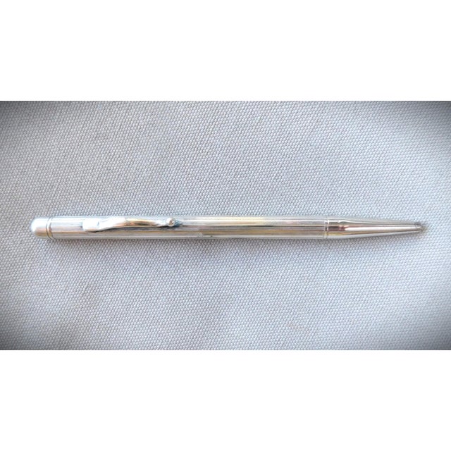 Antique Sterling Silver, 1930's retractable pencil is a standout on a desk or in a business jacket pocket. There is a...
