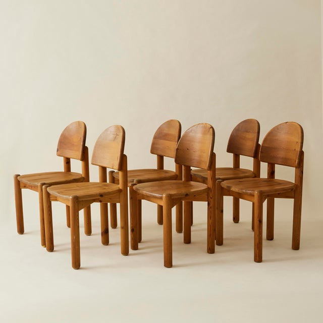 Set of 6 pine dining chairs by Danish Designer Rainer Daumiller from the 1960's-1970's. These sculptural chairs are as...