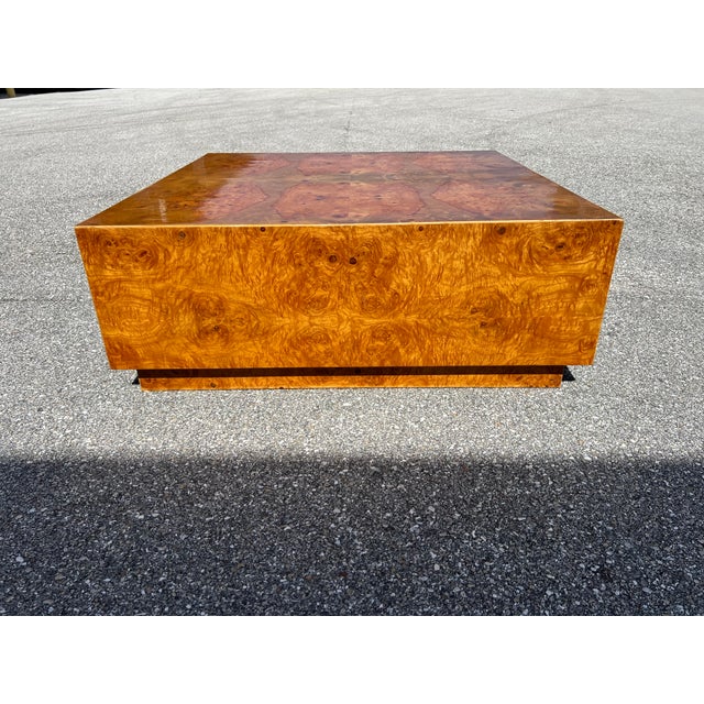 This is a 1970s organic modern olive burl wood coffee table’s attributed to Milo Baughman. The wood is a beautiful olive...