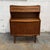 A Danish teak secretary desk from the 1960s, designed by Gunnar Falsig, with a compact upright form and an unusually...