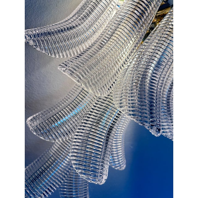 Luxury and and elegant diamanted transparent “SELLE” wall sconce “SELLE” elements in Murano glass poured over a mold from...