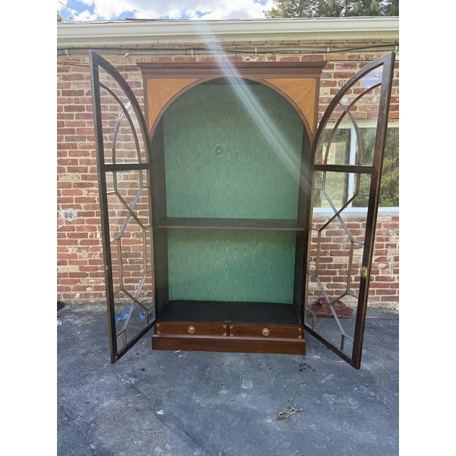 George III Style Inlaid Mahogany Double Glaze Door Bookcase. 19th Century Featuring domed or arched top with geometric...